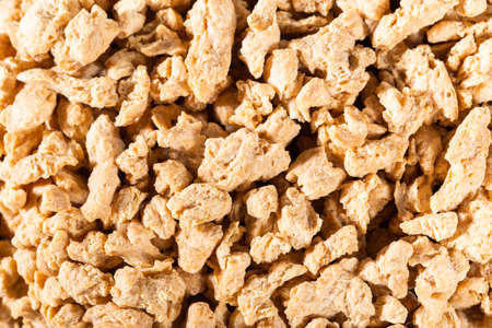 Soy protein textured on old wooden background, close-up