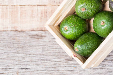 Hass avocado fruits, on wooden background, close-upの写真素材