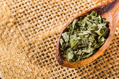 dried moringa leaves in bowl on the table, Moringa oleifera