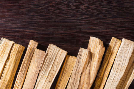 stack of palo santo wood on the table (Bursera graveolens)の写真素材