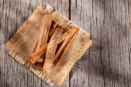 stack of palo santo wood on the table (Bursera graveolens)の写真素材