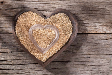 oat grains, flakes and flour on wood backgroundの写真素材