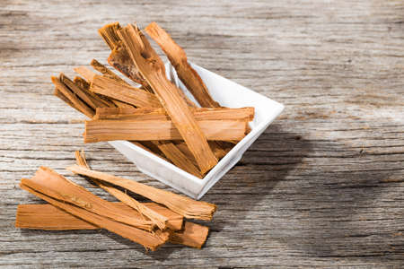 stack of palo santo wood on the table (Bursera graveolens)の写真素材