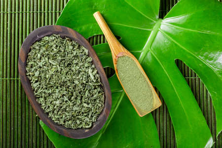 dried moringa leaves in bowl on the table, Moringa oleiferaの写真素材