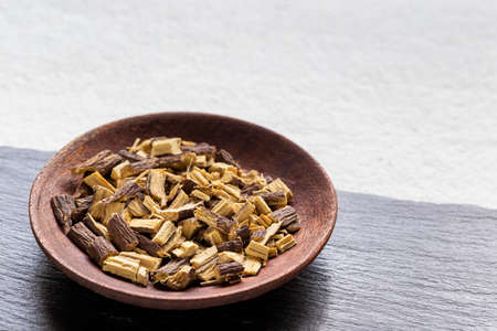Licorice medicinal plant root, on white background - Glycyrrhiza glabraの写真素材