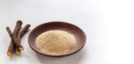 Licorice medicinal plant root, on white background - Glycyrrhiza glabraの写真素材