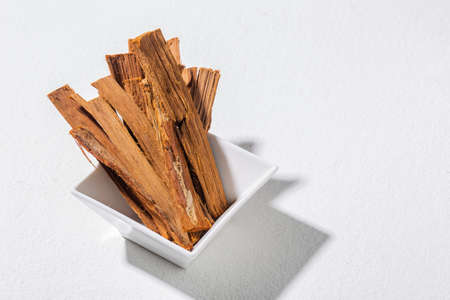 Bark of medicinal plant cat's claw, on white background - Uncaria tomentosaの写真素材