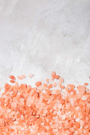 Himalayan pink salt in bowl on the table, close-up imageの写真素材