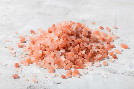 Himalayan pink salt in bowl on the table, close-up imageの写真素材