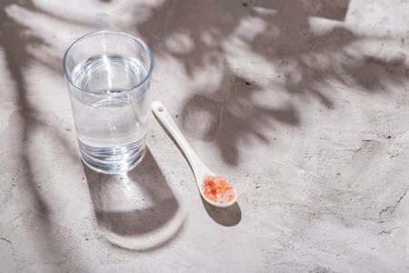 pink himalayan salt, in bowl on white background