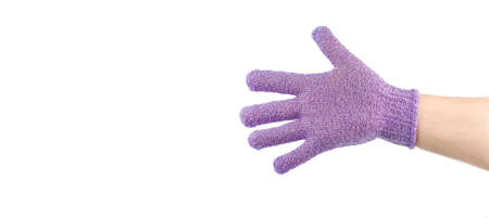 Hand with exfoliating massage glove for shower, space for textの写真素材