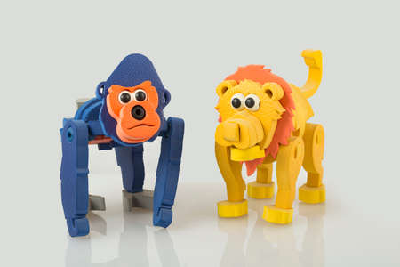 monkey and toy lion, on white background, close up imageの写真素材
