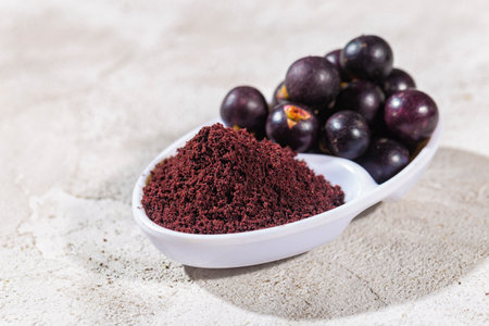 acai fruits and powder, the Amazon fruit with antioxidant powers - Euterpe oleraceaの写真素材