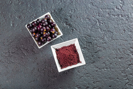 acai fruits and powder, the Amazon fruit with antioxidant powers - Euterpe oleraceaの写真素材