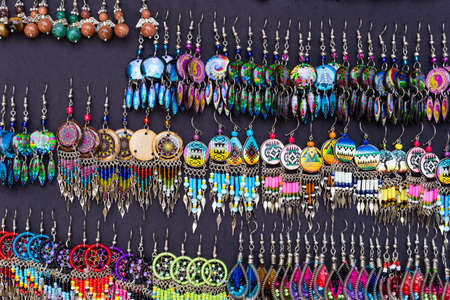 Group of handmade earrings, in street market in Colombia.の写真素材