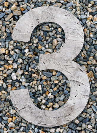 Number 3 with concrete texture, on stones backgroundの写真素材