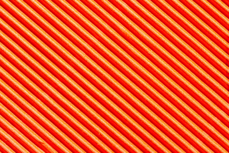orange striped paper background, top viewの写真素材
