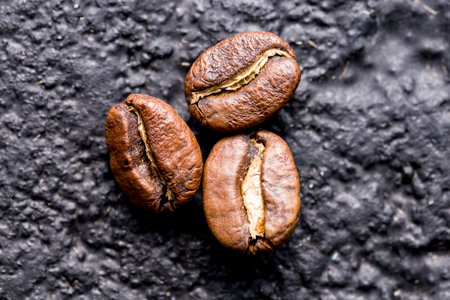 Roasted coffee beans, closeup image, space for text