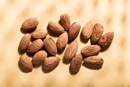 pile of natural almonds (Prunus dulcis) close-up imageの写真素材