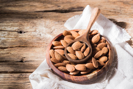 pile of natural almonds (Prunus dulcis) close-up imageの写真素材