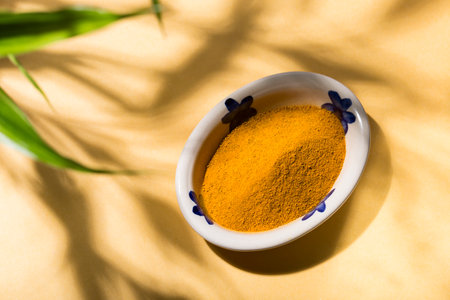 Spice up your life: turmeric in a delicious curry dish with natural shadesの写真素材