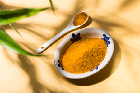Spice up your life: turmeric in a delicious curry dish with natural shadesの写真素材