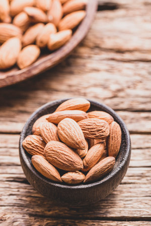 pile of natural almonds (Prunus dulcis) close-up imageの写真素材