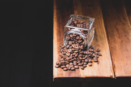 Premium Colombian Coffee Beans on Wooden Plankの写真素材