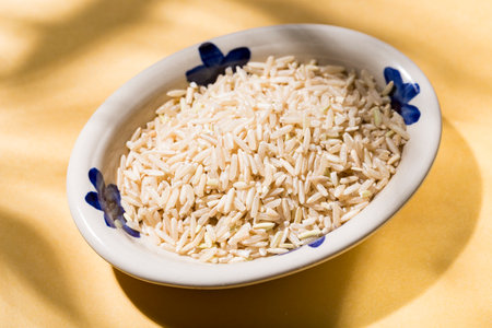 plate with healthy brown rice on the table top viewの写真素材
