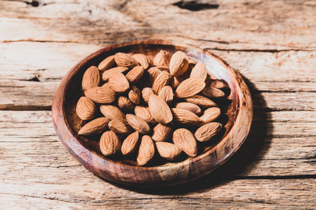 pile of natural almonds (Prunus dulcis) close-up imageの写真素材