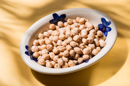 plate of dried chickpeas on the table, top viewの写真素材