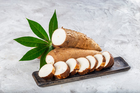 cassava pile, on white background (Manihot esculenta)の写真素材