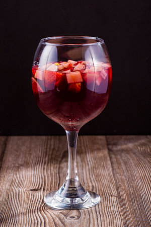 Refreshing glass of sangria over dark soundの写真素材