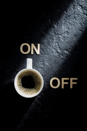 Espresso cup on black background, concept of "coffee activates you"の写真素材