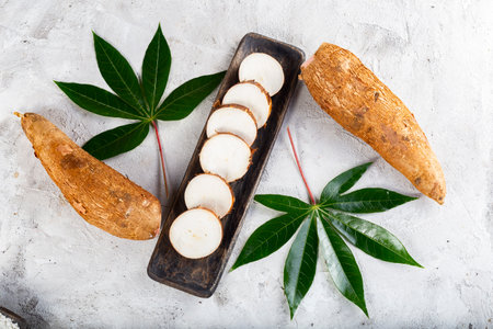 cassava pile, on white background (Manihot esculenta)の写真素材