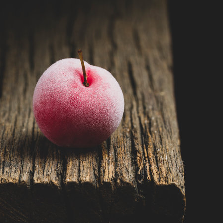 delicious plum on old wood and dark backgroundの写真素材