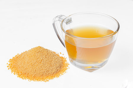 Drink of piloncillo and ground piloncillo, on white background, traditional drink of Colombiaの写真素材