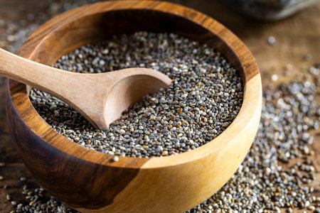 Pile of chia beans in a wooden container, close-up imageの写真素材