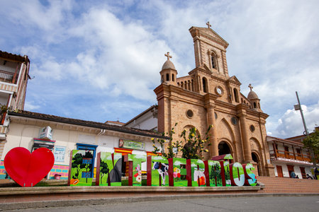 View of the Church of Our Lady of Sorrows, in the main park of EntrerrÃ­os, Antioquia, Colombiaの写真素材