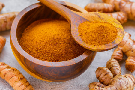 Fresh and Ground Turmeric on Rustic Background â Natural Health and Culinary Ingredientの写真素材