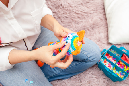 Woman doing toy eyesの写真素材