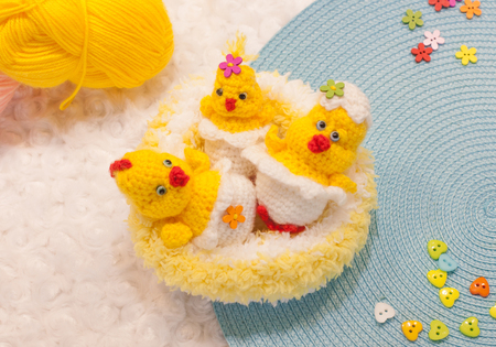 Knitted Chicks in the nestの写真素材