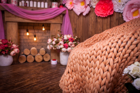 plaid knit hierophany of yarn lying on the rattan armchairの写真素材