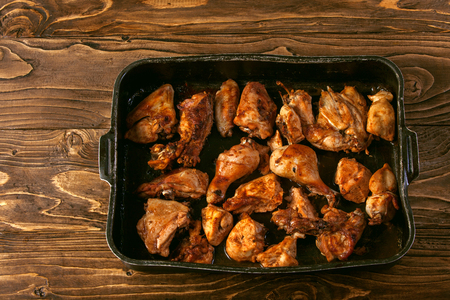 Baked chicken pieces on baking sheetの写真素材