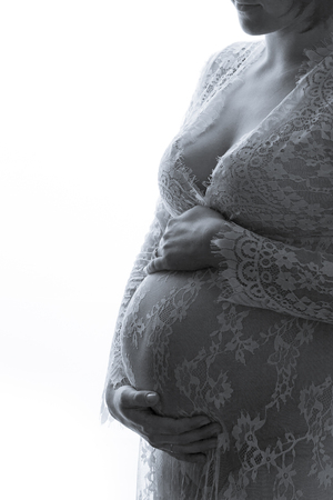 Pregnant Woman Belly. Conception of Pregnancy, black and white, isolatedの写真素材