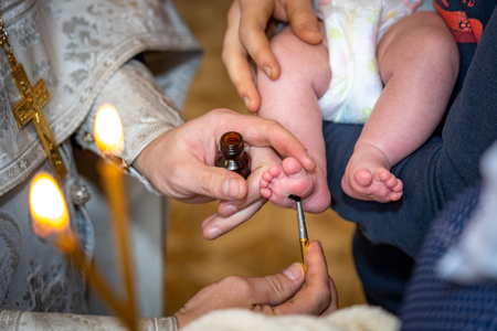 baptism of a child in the Church, the process of anointing