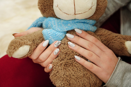 nail manicure with picture of cat and inscription catの写真素材