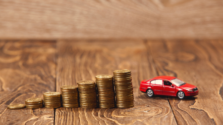 concept of accumulation on the car, the ladder of coins leading to the goalの写真素材