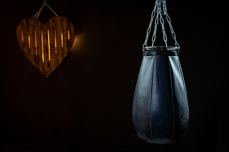 a punching bag on a black background. with free text space. the concept of love for martial artsの写真素材