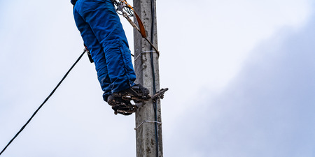 the electrician vysotnik makes installation of power gridsの写真素材